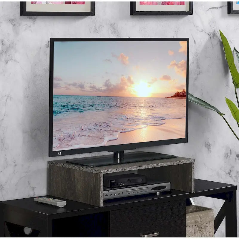 Rehausseur TV/moniteur compact et pratique, adapté aux téléviseurs jusqu'à 26 pouces.