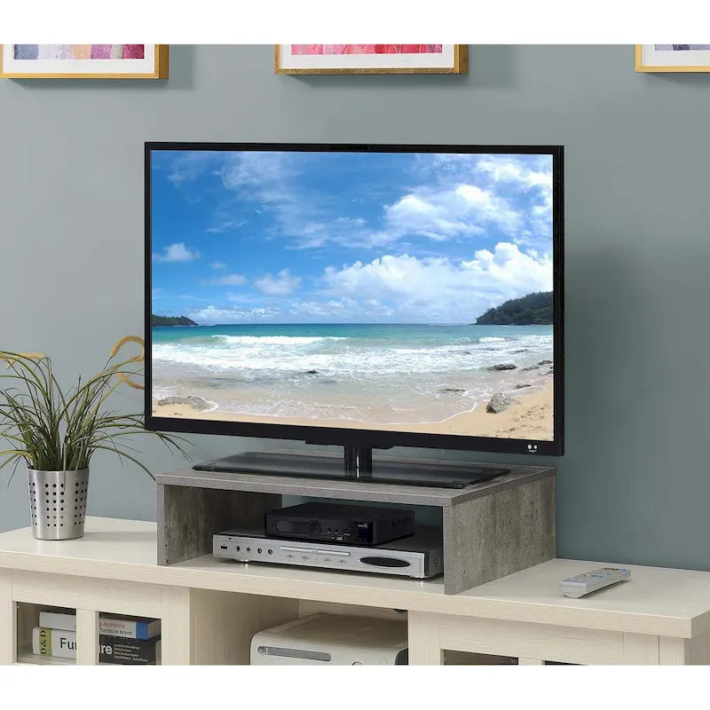 Rehausseur TV/moniteur compact et pratique, adapté aux téléviseurs jusqu'à 26 pouces.