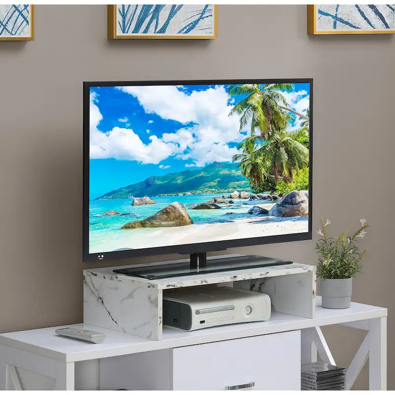 Rehausseur TV/moniteur compact et pratique, adapté aux téléviseurs jusqu'à 26 pouces.