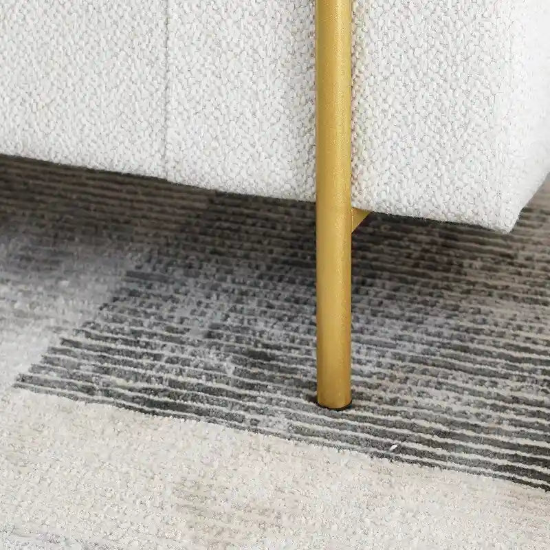 Banc de rangement rembourré avec accoudoirs enroulés et pieds dorés