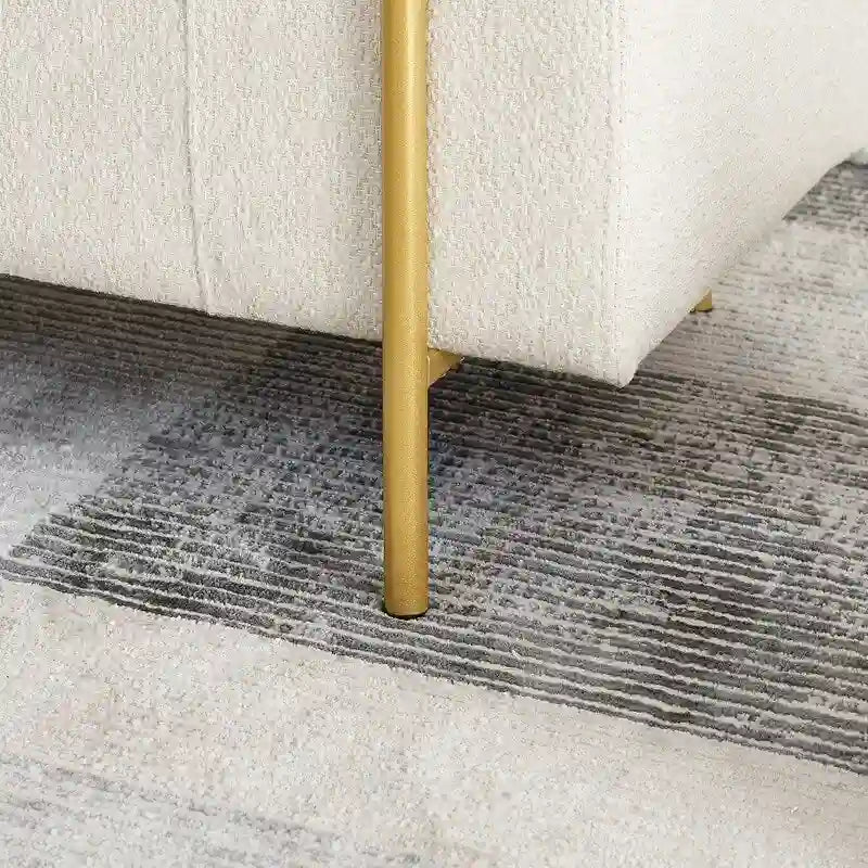 Banc de rangement rembourré avec accoudoirs enroulés et pieds dorés